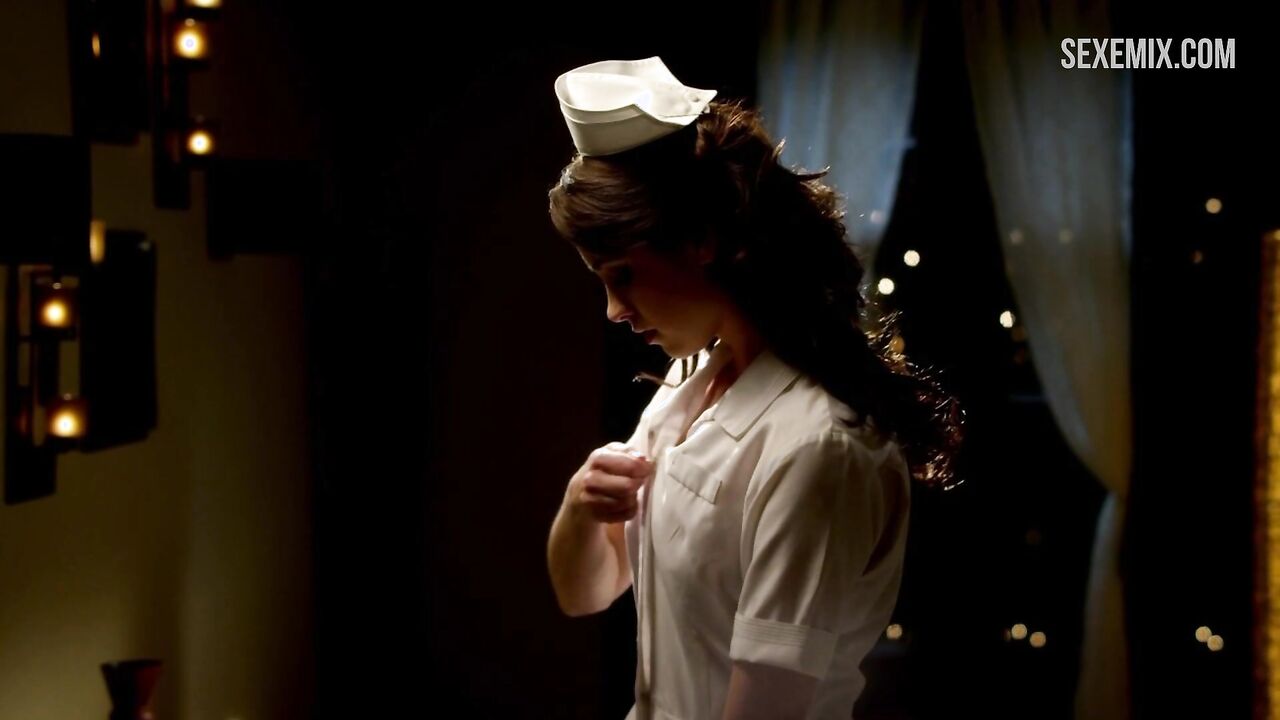 Christine Donlon in a nurse costume scene in - Femme Fatales