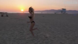 Maria Louis in black bikini on the beach, scene in #FollowMe