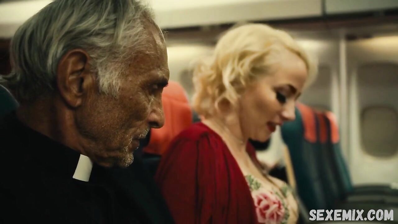 Jin N Tonic shows us her beautiful cleavage, scene in Exorcism At 60,000 Feet