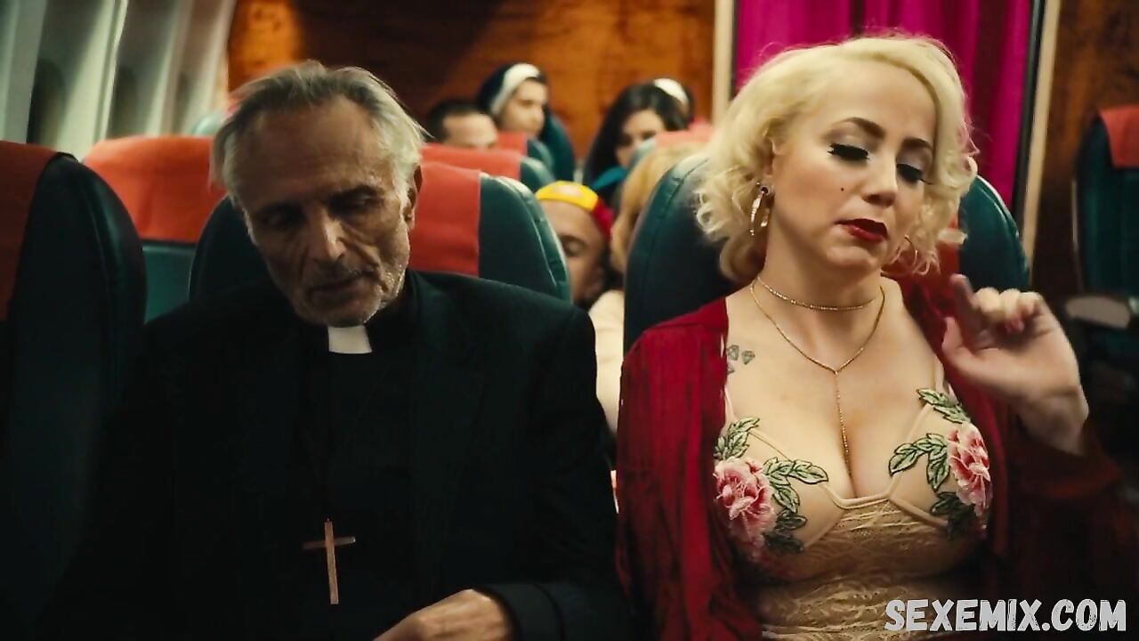 Jin N Tonic shows us her beautiful cleavage, scene in Exorcism At 60,000 Feet