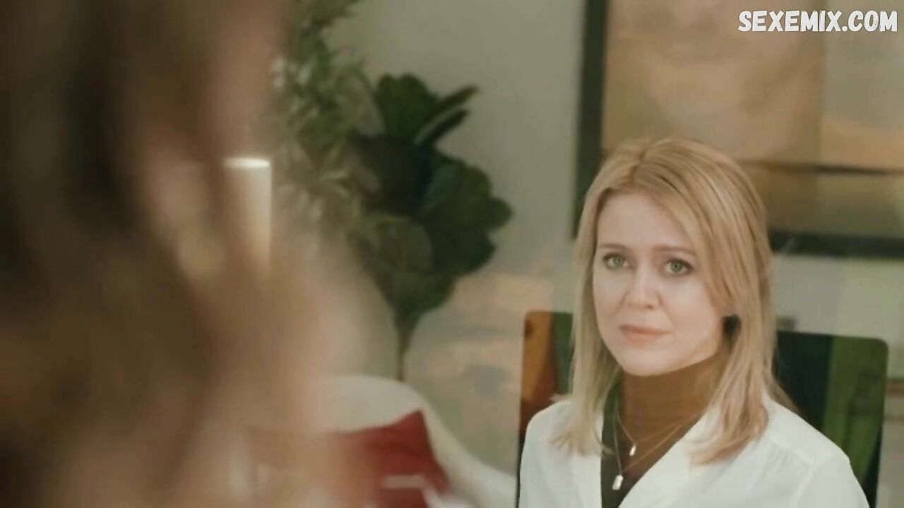 Amy Rutherford as a secretary, scene in Squeegee (2020)